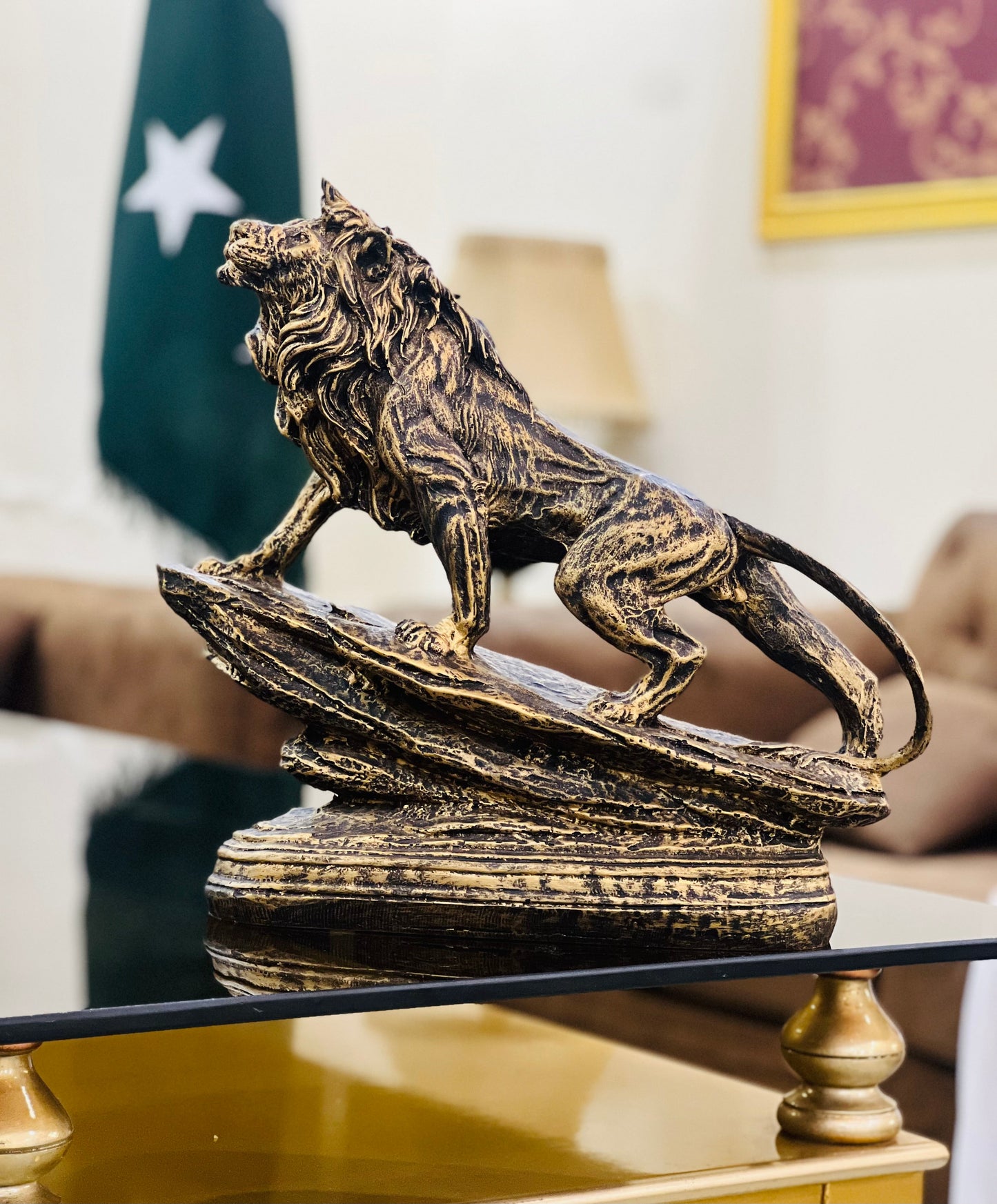 The Roar of Royalty – Golden Lion Sculpture on Cliff Muzamil Decor